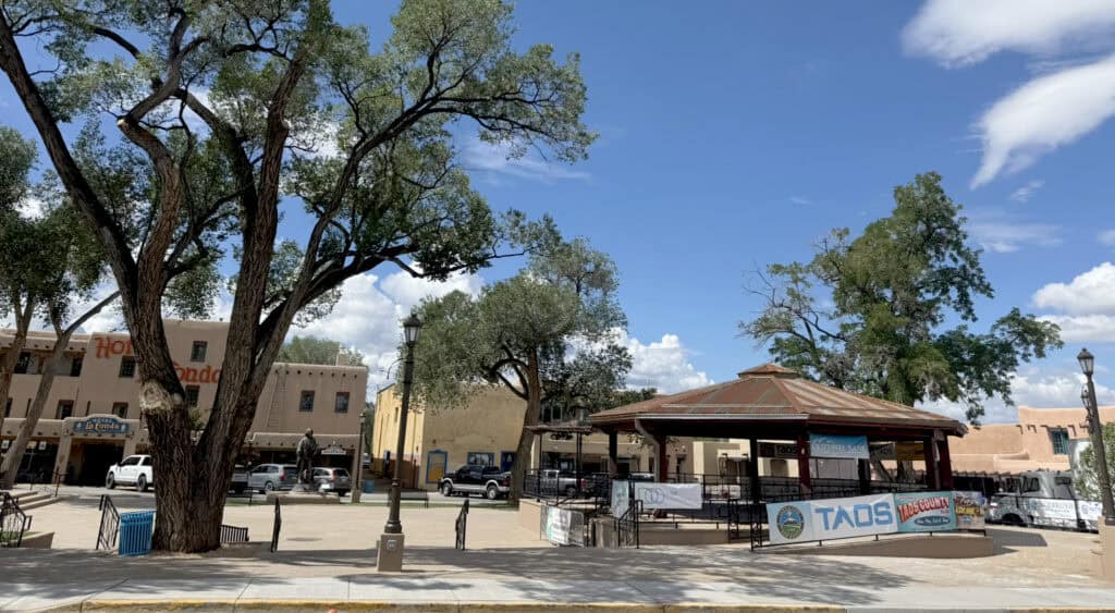Scenic view of Santa Fe Plaza with trees and historic buildings in New Mexico.