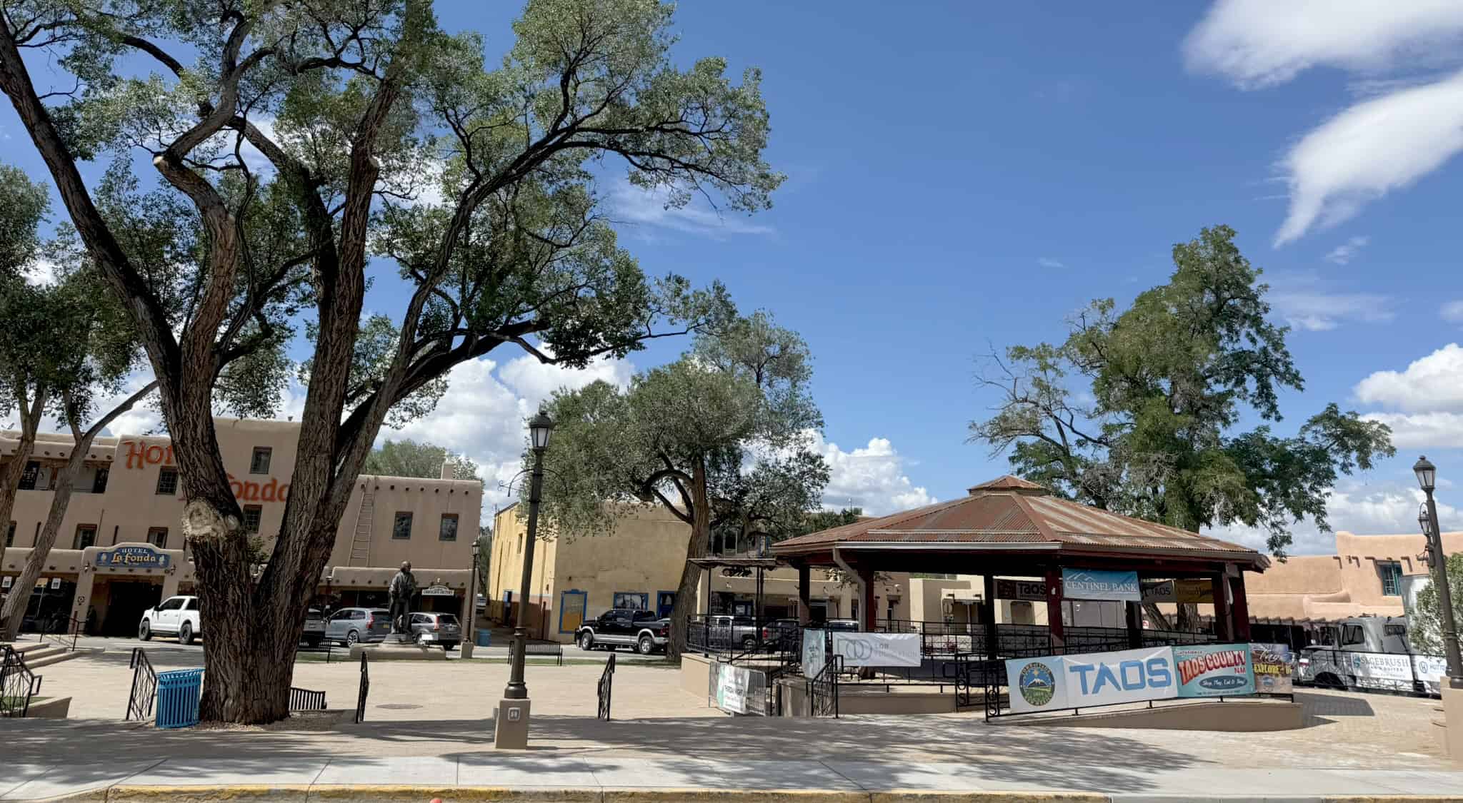 Scenic view of Santa Fe Plaza with trees and historic buildings in New Mexico.