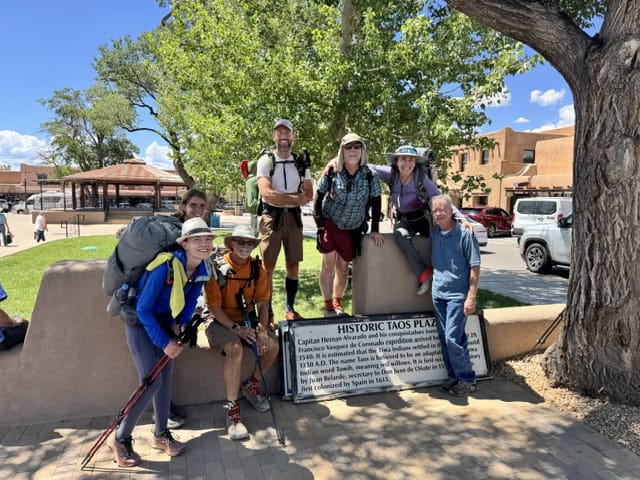 Group of hikers at Historic Taos Plaza during Santa Fe to Taos Thru-Hike.