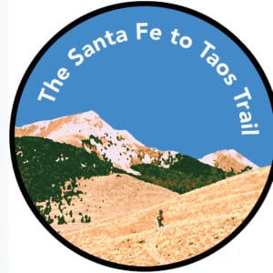 Hiker on trail with mountain views during Santa Fe to Taos Thru-Hike.